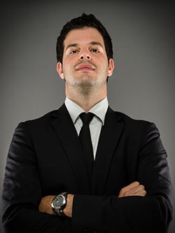 Man in business attire looks down arrogantly from above